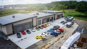 Aerial view of The Hide Out Supermax Suites with cars lined up at the doors during a V8's & Vaults event